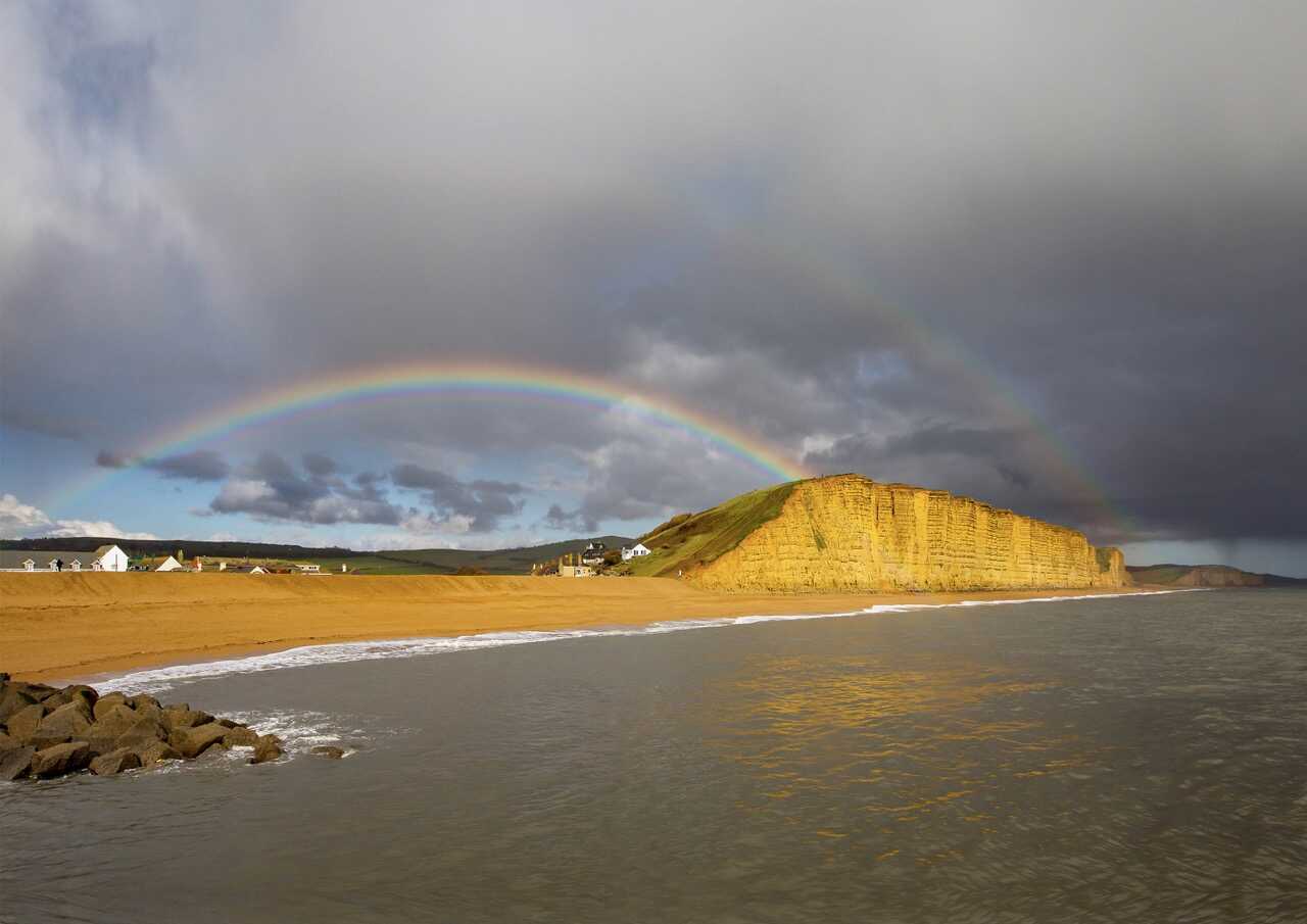 Rainbow and sea light at West Bay